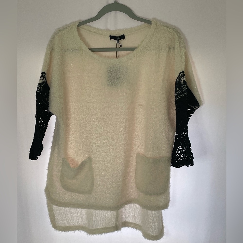 Mesh sleeves and a very soft fabric around the front and back